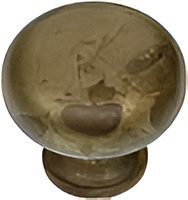 Round glass knob with intricate design.