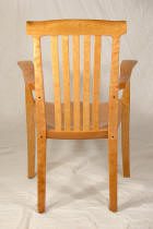 Wooden chair with slatted backrest and arms.