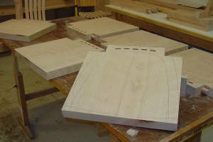 Wooden panels on a workshop table.