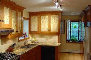 Modern kitchen with wooden cabinets and countertops.