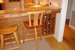 Wooden bar stools and wine rack.