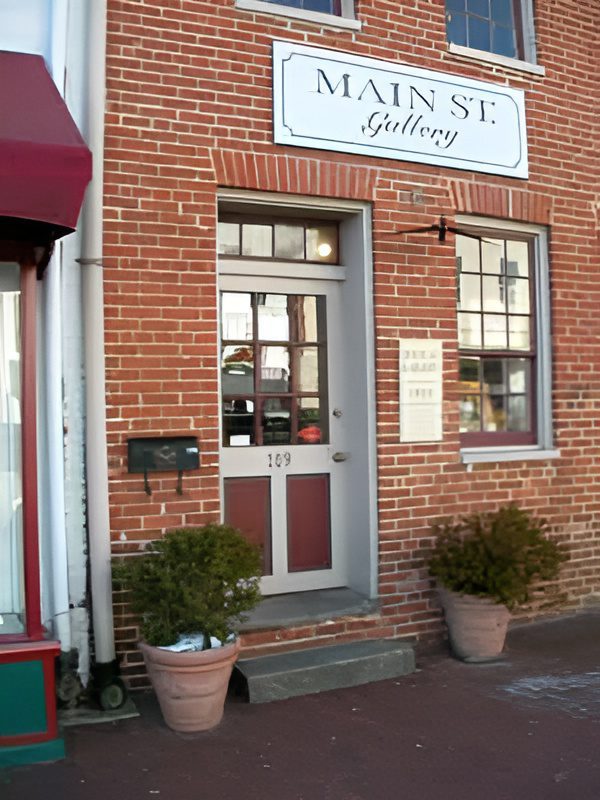 Brick storefront labeled "Main St. Gallery.