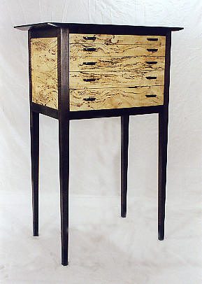 Wooden side table with four legs.